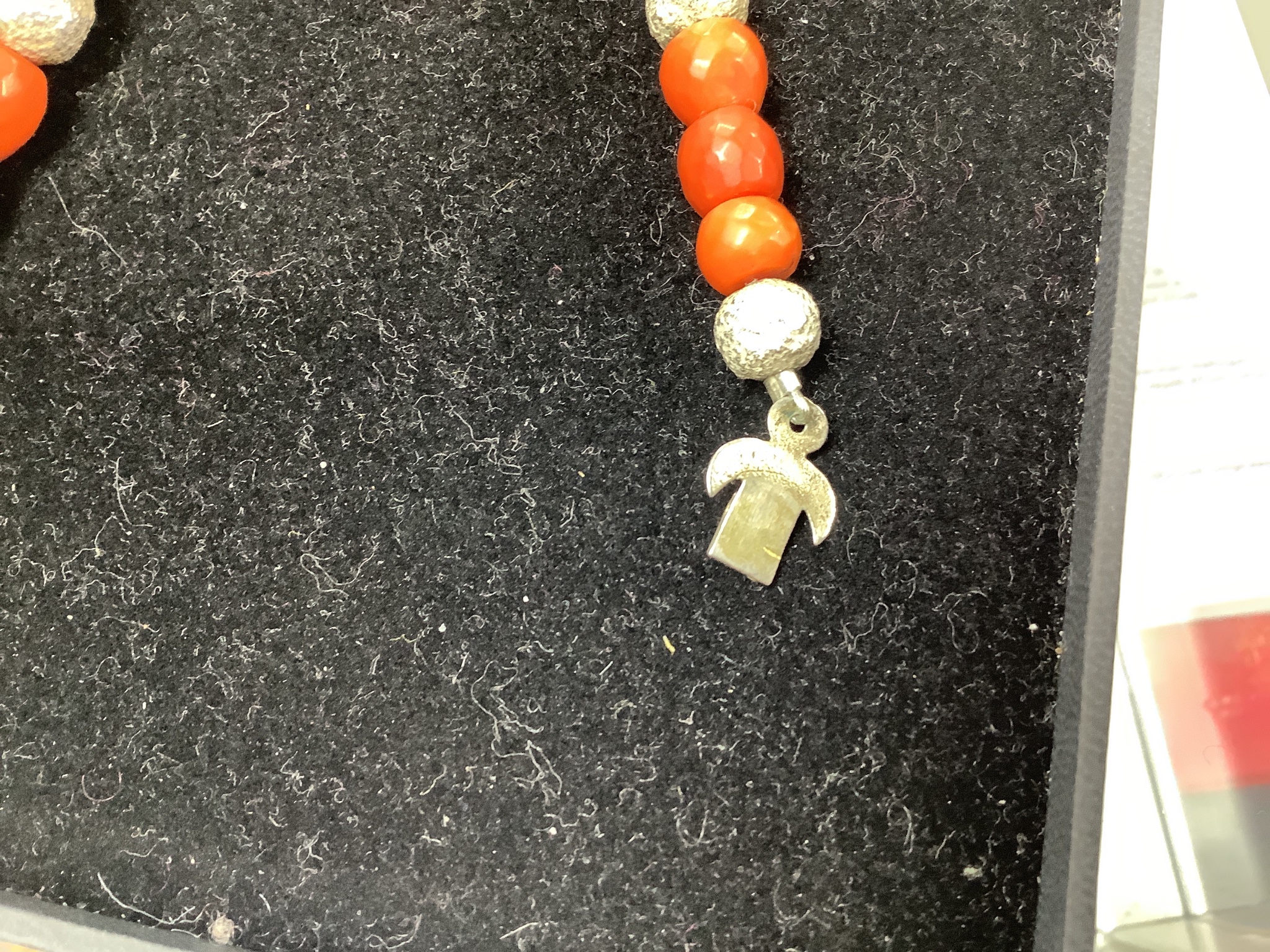 A modern Pruden Smith coral and white metal bead necklace, approx. 42cm and a pair of matching drop earrings